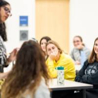 Students in the classroom receiving instruction from faculty member